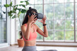 © weedezign - Asian woman wear virtual reality glasses choosing training yoga class online at home