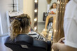 © evgeniia_1010 - Creating a stylish braid while a girl enjoys her time in the salon