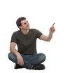 © 1STunningART - Positive young man sitting on the floor pointing forefinger up smiling with confidence. Solving problem, find solution, business idea and creativity concept. Male isolated on transparent background