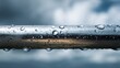 © Honey - Stunning close-up of water droplets clinging to a metallic railing on a moody day