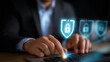 © Kateryna - A holographic cybersecurity dashboard glows with shield and lock icons data grids flashing behind as a businessman activates protective barriers with a touch. The scene conveys