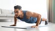 © trinset - Push-up workout routine for fitness enthusiasts at home indoor exercise motivational environment personal growth