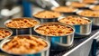 © PrettyVectors - Wet pet food being portioned into aluminum cans. Industrial food production line