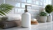 © SIRIN - Modern white ceramic soap dispenser and stacked towels in a bright bathroom setting