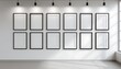 © andrew - 3D render of a white wall with ten empty black picture frames arranged in two rows on the wall The room is welllit and has a minimalist design with soft light