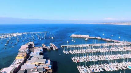Wall Mural - aerial drone view of Monterey Bay, California with wharf and boats in marina