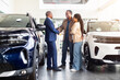 © Anastasiya - African American couple shaking hands with car dealer in showroom, celebrating successful agreement, lifestyle concept of vehicle purchase, trust, finance and ownership