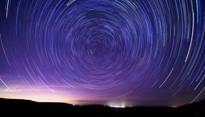 Wall Mural - celestial timelapse capturing star trails in concentric circles around polaris deep purple night sky