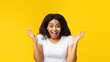 © Prostock-studio - Wow offer. Emotional african american woman expressing amazement and looking at camera over yellow background, studio shot. Unbelievable and shocked news, omg emotion concept