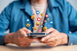 © Kiattisak - Digital content and engagement concept. Man using smartphone with social media interaction, online feedback, and emotional expression in mobile communication.