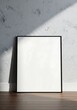 © mohibul - Blank frame mockup on floor against textured wall with sunlight overlay