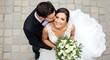 © Budi - High-angle View of a Groom Kissing His Bride