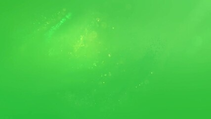 Wall Mural - small glowing particles of light drift in a hazy, abstract cloud on a green screen background.
