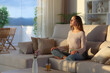 © PheelingsMedia - Casual woman breathing fresh air meditating at home