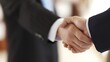 © hhh - A professional handshake between two individuals, conveying trust and formal elegance.