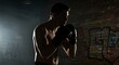© Alex - Boxer silhouette in dark gym with smoke and graffiti.