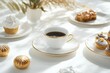© Odrua Design - Xícara de café elegante com detalhes dourados, acompanhada de doces e decorações festivas em fundo branco, criada com IA generativa para um visual sofisticado e convidativo