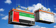 © PX Media - Shipping containers with flags of United Arab Emirates and Mercosur