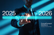 © Sumiya - Businessman advances towards the future year 2026, businessman pressing virtual button