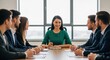 © Ty - A group of business professionals in a meeting room, discussing a project.