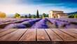 © Shelby - wooden table top with blurred coffee shop background and lavender fields in provence france rustic charm and tranquil ambience