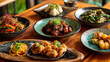 © Sabana - An overhead shot of various asian dishes served on plates on a wooden table top view