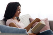 © Prostock-studio - Covid-19 outbreak, education at home, study, intellectual hobbies and day planning. Cheerful smart young african american woman reading book on sofa, living room interior, free space, side view