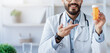 © Prostock-studio - Doctor recommends pills to patient, pharmacy consulting about illness and medication via video call. Smiling young arabian man in coat and glasses show bottle of medicines in clinic in office