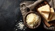 © Hijau - Grated cheese in bowl, sliced cheese on wooden board, dark background