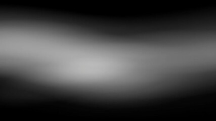 Subtle gradients of gray blend seamlessly in a soft, blurred background, creating a calming and neutral backdrop for various design and artistic applications