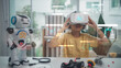 © FAMILY STOCK - A child wearing VR headset learning with AI hologram and robot assistant. Concept of STEM education, robotics, digital learning, future technology, and smart classroom innovation.
