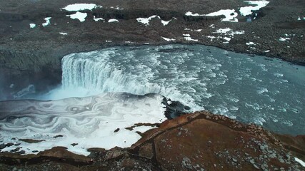 Wall Mural - Powerful Dettifoss waterfall cascading in a scenic Icelandic landscape