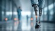 © Oulaphone - A close-up of a person walking with advanced prosthetic legs, showcasing technology and mobility in a modern environment.