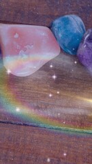 Wall Mural - Animation of stars and galaxies moving over stones on wooden surface