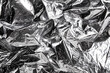© Natalie Jeffcott - Abstract metallic foil background with crumpled and reflective surface
