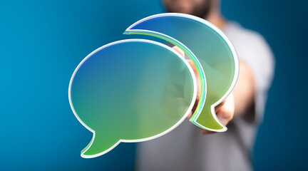 Image of a man showcasing digital speech bubbles, ideal for communication, conversation, and teamwork concepts.