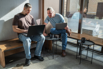 Business project team working together at meeting room at office. Programmers working in the office of a software development company. Coding technologies