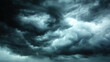 © buraratn - Dramatic storm clouds fill sky, creating moody and intense atmosphere. swirling patterns and dark shades evoke sense of impending weather changes and nature power