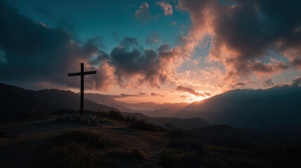 Wall Mural - serene landscape featuring wooden cross silhouetted against dramatic sunset. sky is filled with clou