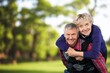 © BillionPhotos.com - Joyful old couple embracing posing in a natural setting.