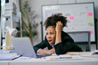 © Parichat - Shocked businesswoman looking at laptop with worried expression in office