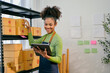 © Parichat - Small business owner checking packages in her storehouse