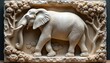 © Viktor - Elegant elephant bas-relief stone carving art. Majestic animal sculpted with detailed texture. Three-dimensional artwork in grey and white, perfect for sophisticated interior decor, print, or canvas.