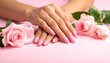 © Tanto - Close-up of manicured hands with pink roses