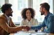 © Viktor - Diverse business team in office meeting. African executive welcomes client, partners shake hands sealing deal. Teamwork, trust, cooperation achieved in pro environment. Successful negotiation.