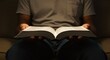 © Photyn Studio - Close of a person reading the Holy Bible, representing Christian faith, devotion, and spirituality
