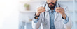 © Prostock-studio - Problems at work, overwork in clinic, first symptoms of disease. Tired sad millennial arabian bearded guy doctor in white coat takes off his glasses, sits at desk in office interior, free space