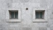 © Cholil - Two square windows in a light gray stone wall