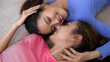 © Pichsakul - Asian adult women lesbian couple share intimate moments at home. Happy connection expresses love and tenderness.