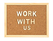 © TransPicHub - A cork board with the words 'WORK WITH US' prominently displayed in wooden letters.